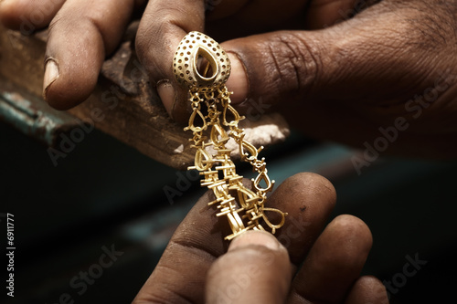 Goldsmith and earring.