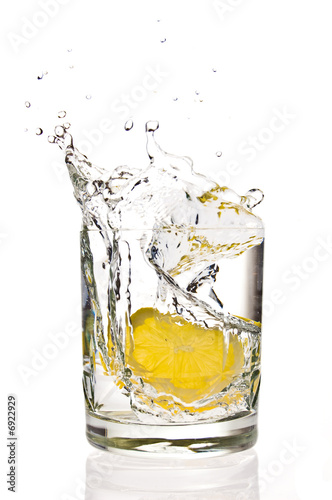 Lemon splashing in martini glass
