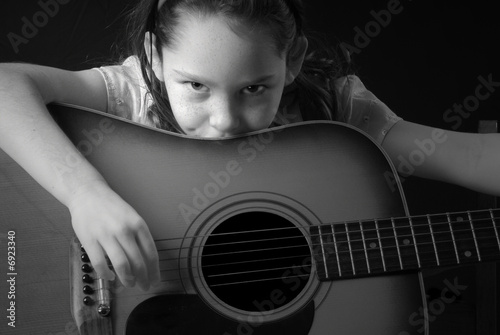 Vászonkép Girl Playing Guitar