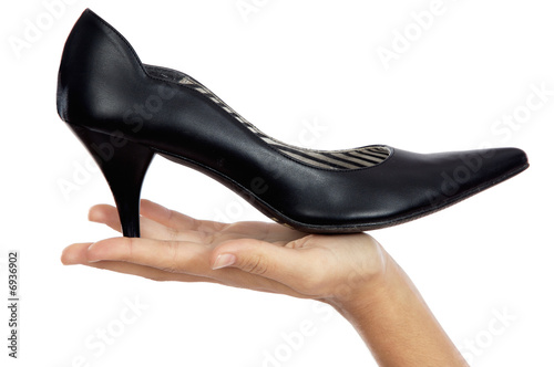 Hand whit shoe