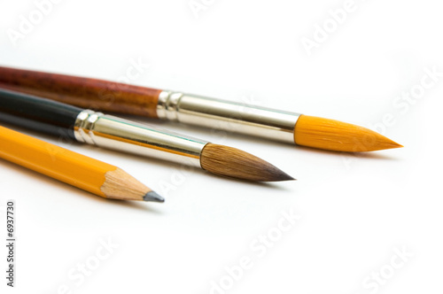 Paintbrushes and pencil close up