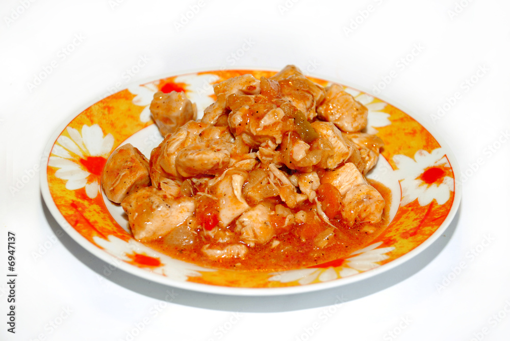 meat in piquant sauce isolated on plate