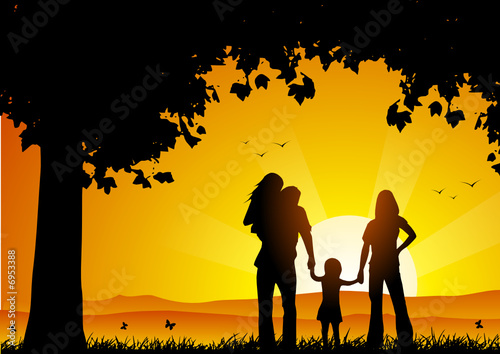 Family at sunset under a tree