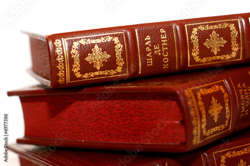 Two horizontal red books on white 