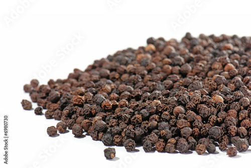 Black pepper in close-up isolated on white background