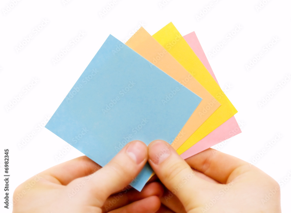 human hand holding stickers on white background human hand holding stickers on white background