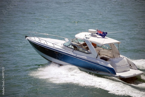 Blue Sport Fishing Boat with White Aluminum Canopy © Wimbledon