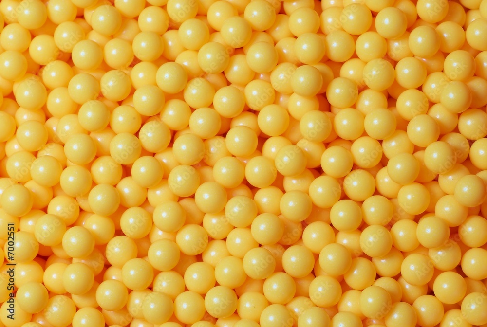 A pile of yellow round balls. A pile of yellow round balls.