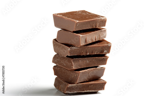 Stack of brown chocolate on white background