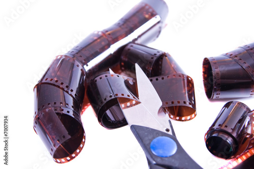 Scissors cutting a photographic film photo