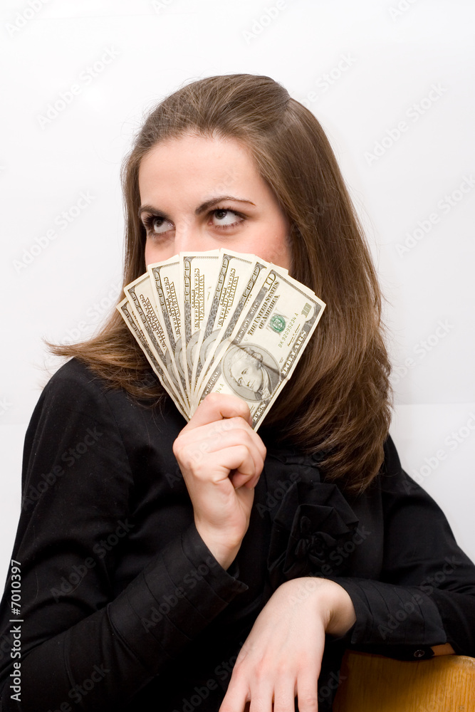 Beautiful business woman holding money and smiling Beautiful business woman holding money and smiling