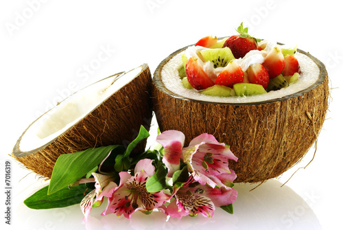fresh fruit salad served in half coconut