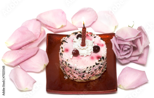 cake with candle and pink rose