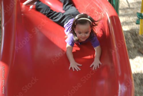 little girl playing in playground at atlanta zoo photo