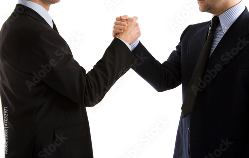 Two businessmen handshake in a friendly way