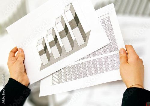 business lady analysing graphs