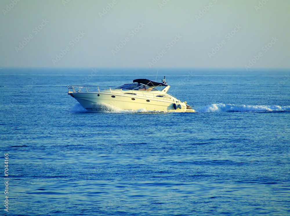 Naklejka premium A fast speedboat on blue sea