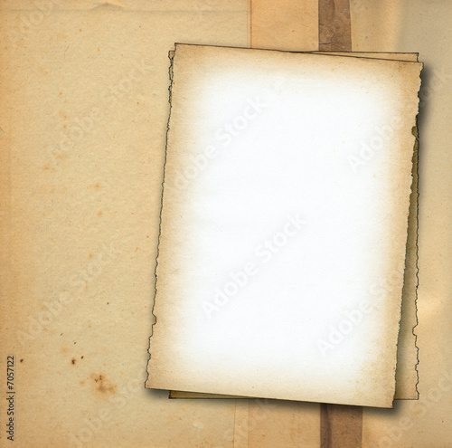 two pieces of old paper against dirty background