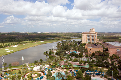 Resort with hotel, pool, golf course and lake, taken from above