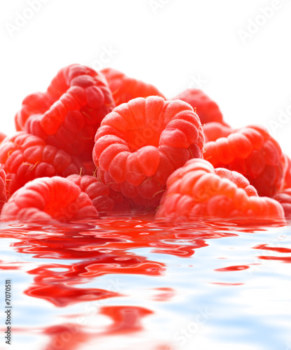 Raspberries reflected in water