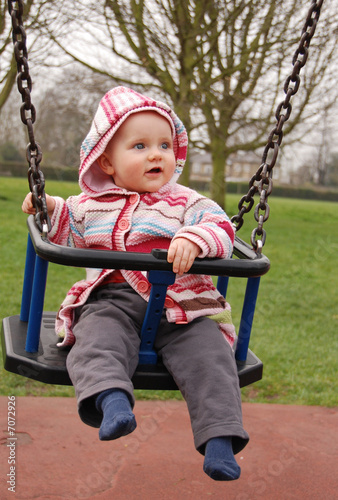 baby girl in a swing © annika
