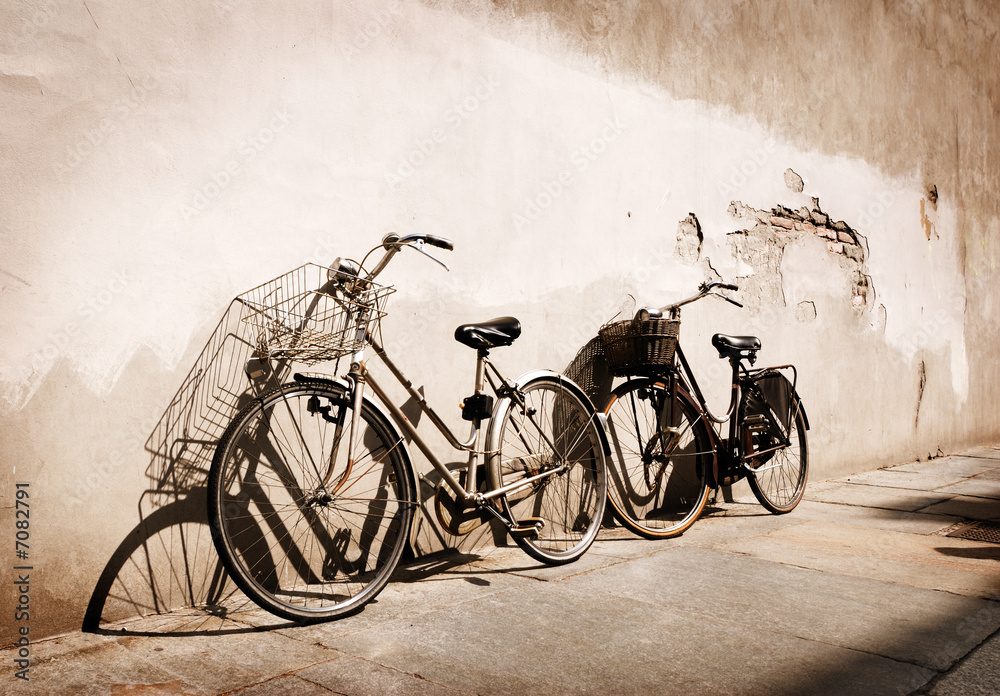 Italian old-style bicycles leaning against a wall 