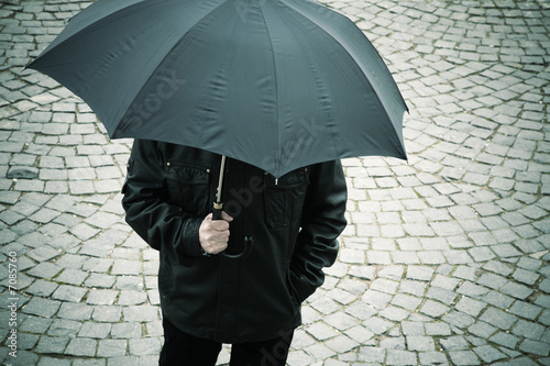 man with umbrella photo