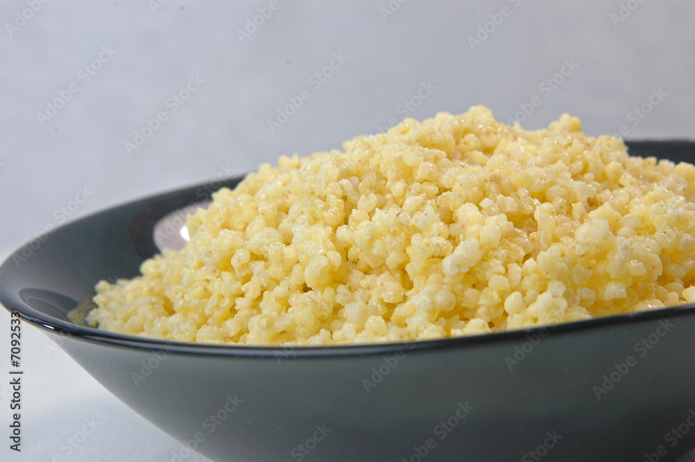 millet groats porridge in black plate