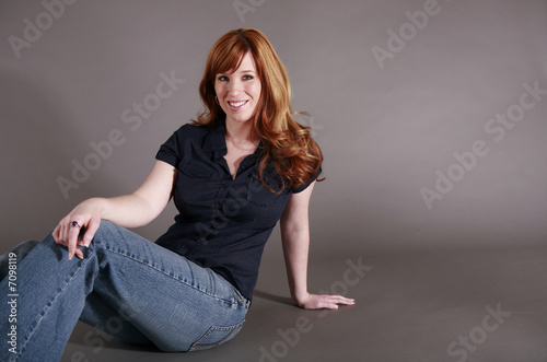 Redhead sitting on floor