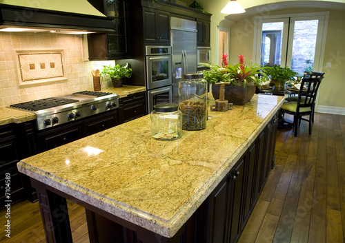 Luxury kitchen with a modern granite island.