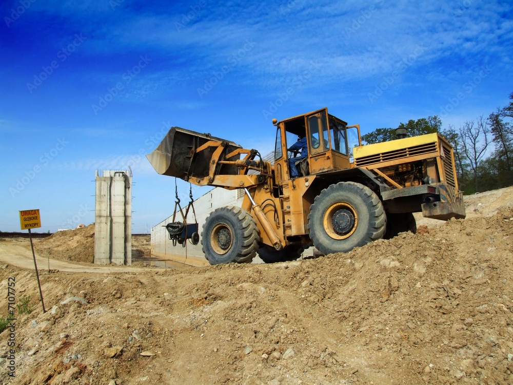Front loader unloading concrete rubble Front loader unloading concrete rubble
