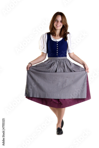 Photo woman in Dirndl drops a curtsey