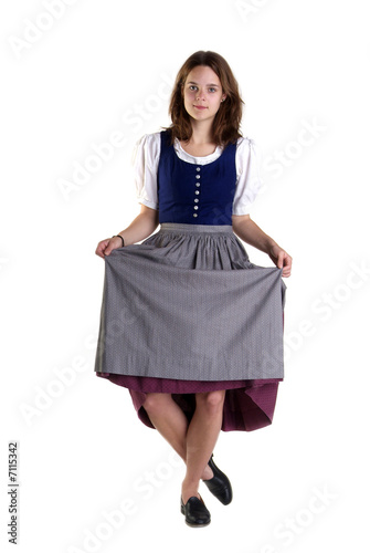 Photo woman in Dirndl drops a curtsey