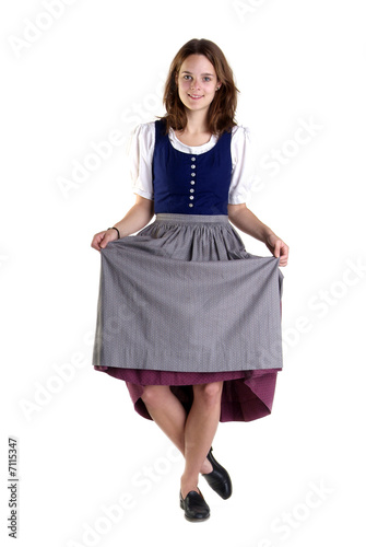 Valokuva woman in Dirndl drops a curtsey