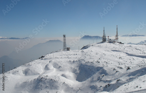Telecommunications tower with satellite dish in winter © ChristianFallini