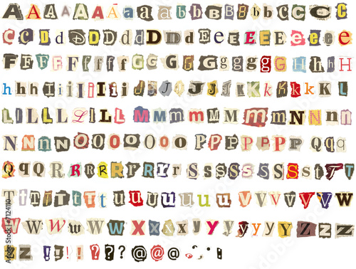 Tableau sur toile Torn newspaper letters alphabet