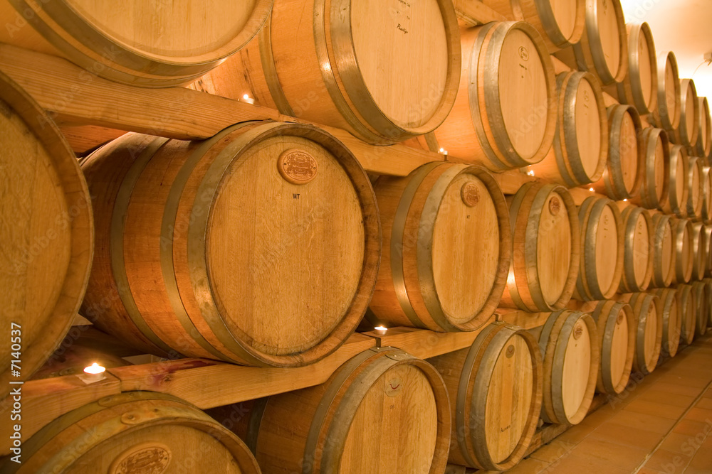 stacked win barrels in the wine cellar stacked win barrels in the wine cellar