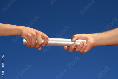 hands giving baton