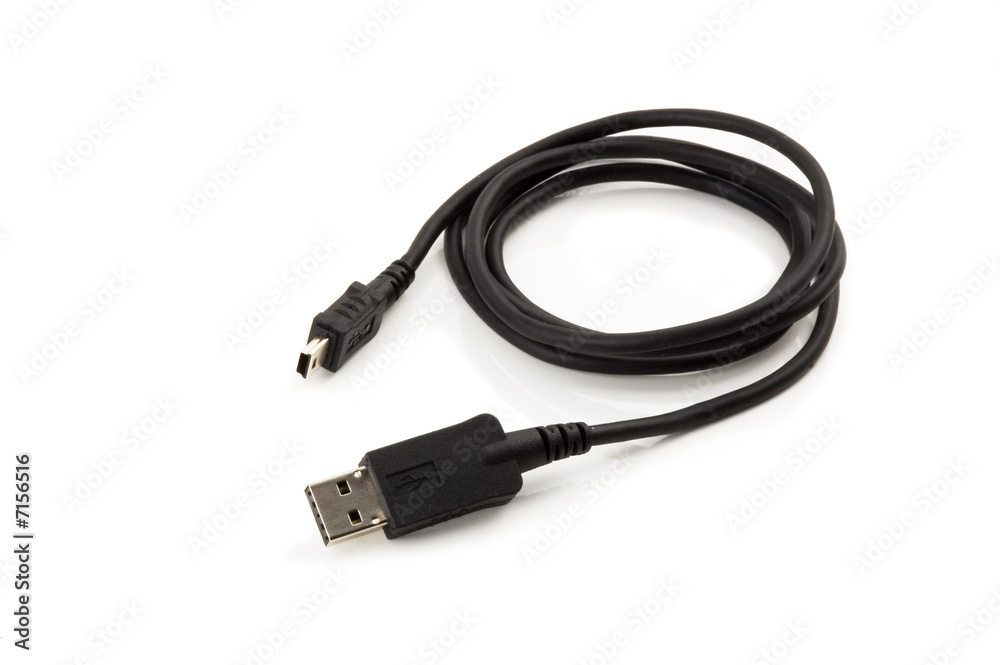 usb cable with mini-usb laying on a white background usb cable with mini-usb laying on a white background