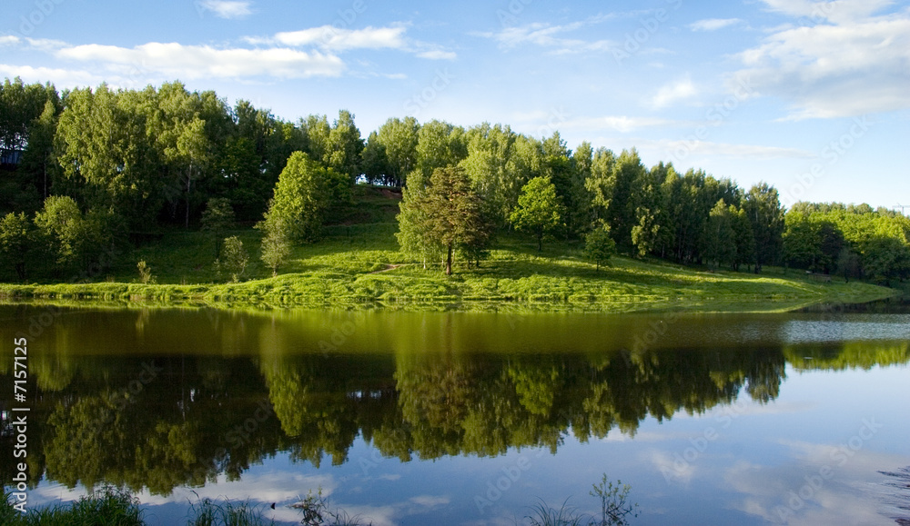 Blue reflection in river at summer forest, Russia Blue reflection in river at summer forest, Russia