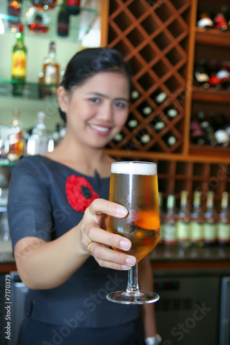 bartender giving the beer
