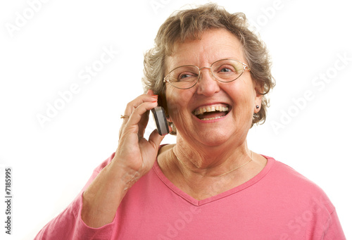 Smiling Senior Woman Using ...
