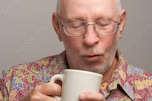 Senior Man Enjoys His Coffee
