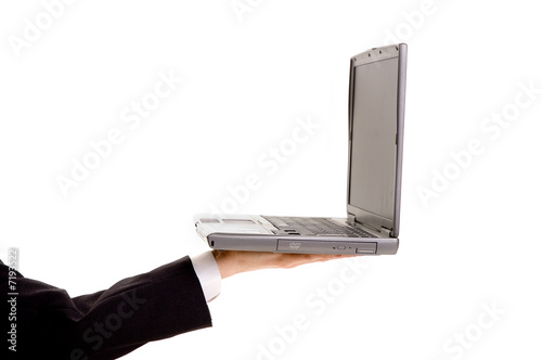 Laptop computer in a businessman's hand