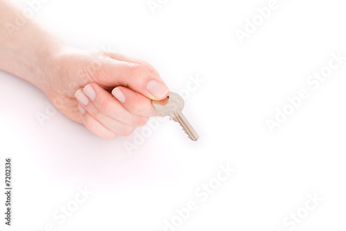 hand giving a key