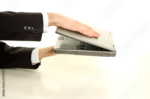 Businessman is closing his laptop