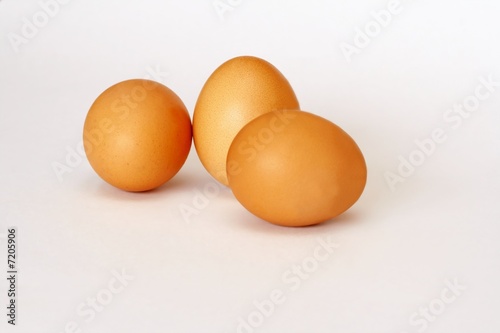 Three eggs on white background