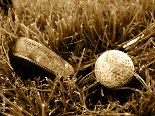Rough old gold club and ball sepia image #7208340