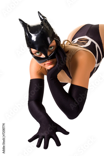 Close-up of young girl in cat mask (isolated on white) photo