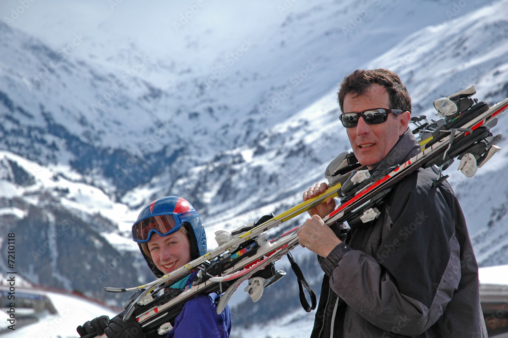 father and daughter going skiing